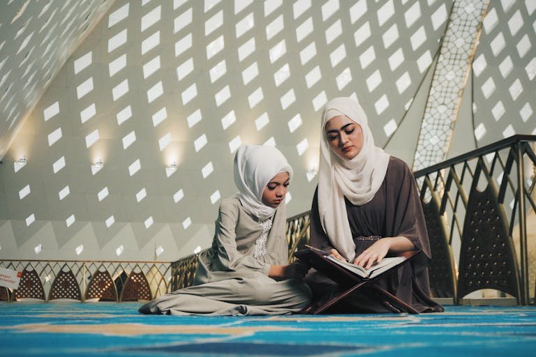 Two Muslim friends exemplifying choosing the right friends in Islam with a mosque backdrop